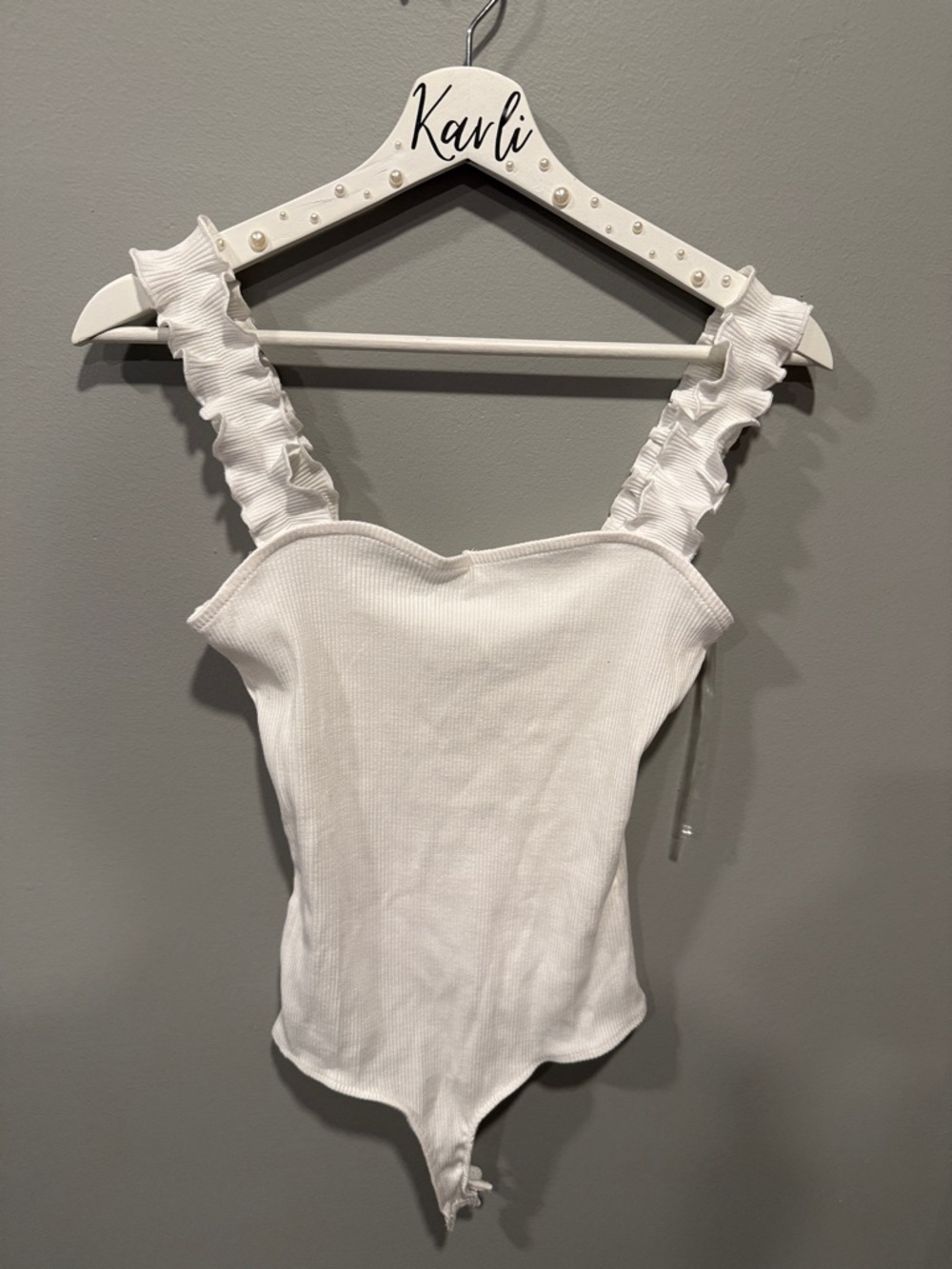 White Ribbed Ruffle Strap Bodysuit